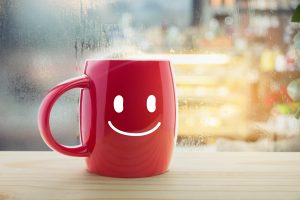 Coffee cup with smiling face