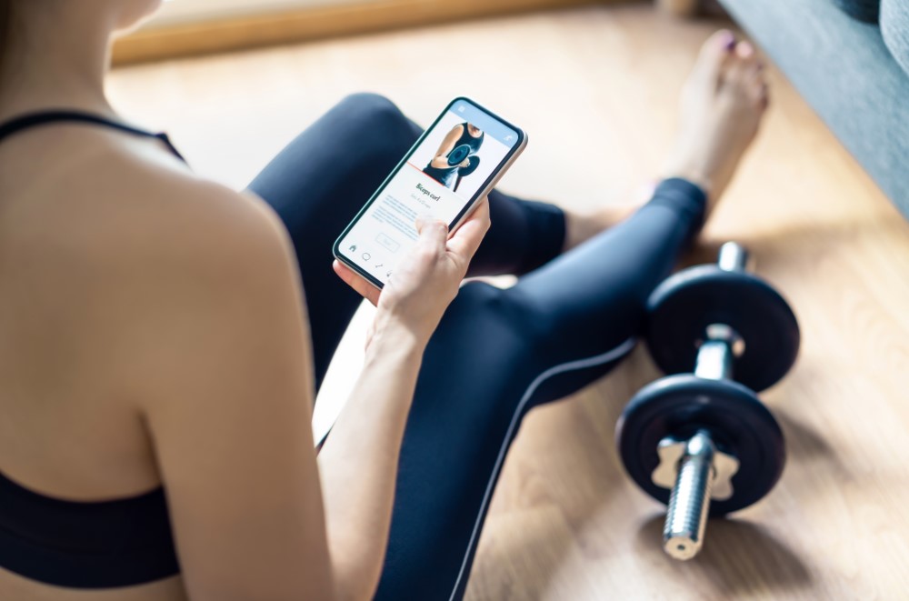 Woman excercising with fitness app