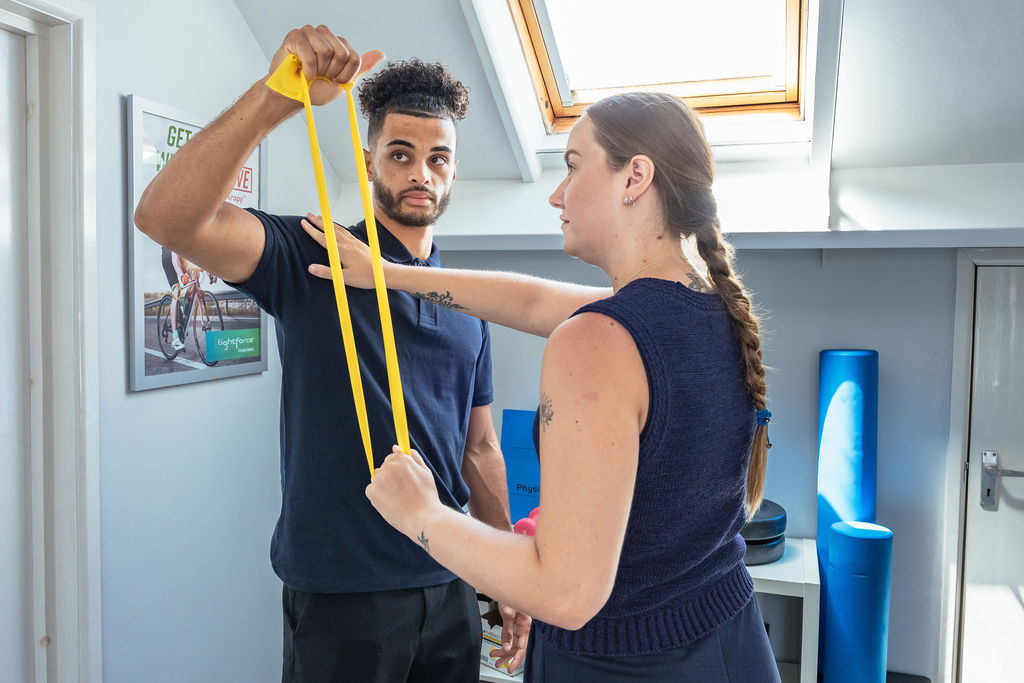 Jerrika showing patient sports therapy exercise